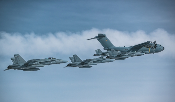 Four Finnish F/A-18 Hornets and a German A400M