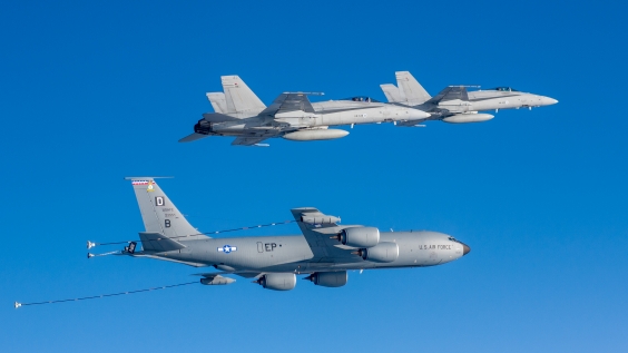 KC-135 Stratotanker and two F/A-18 Hornet multi-role fighters.