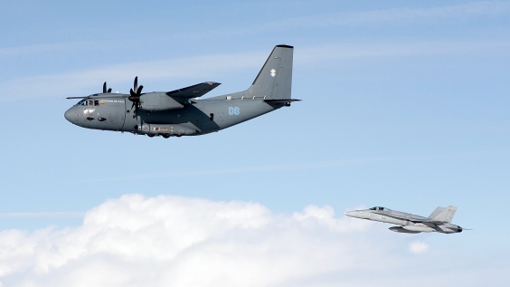 F/A-18 Hornet escorting a Lithuanian Air Force C-27J Spartan simulating a COMLOSS aircraft