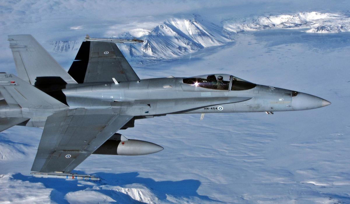 F/A-18 Hornet fighter jet flying over a glacier in Iceland