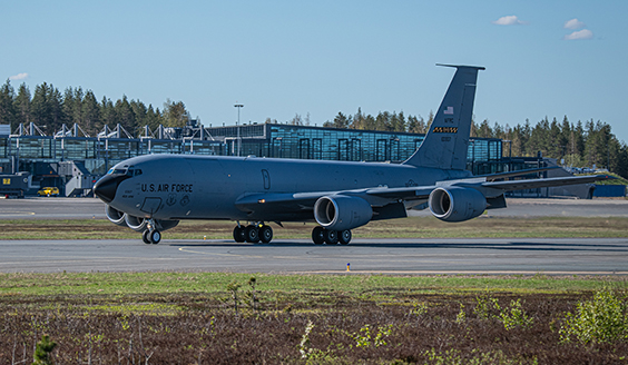 U.S. Air Force KC-135 Stratotanker air fueling aircraft in Rovaniemi at the Arctic Challenge Exercise 21. The aircraft is taxiing. Behind the KC-135 is Rovaniemi airport.